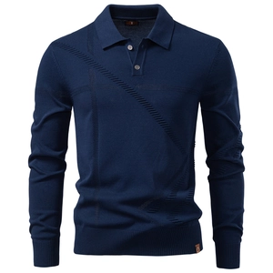 Macro view of navy blue knit polo shirt showing jacquard texture and polo collar details