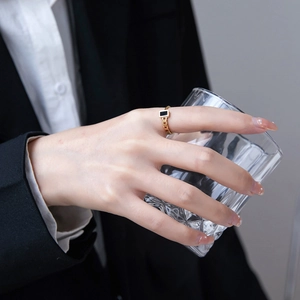 Minimalist 18K gold plated chain ring with a black rectangular enamel piece on hand