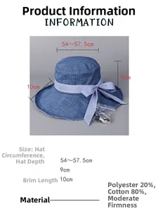 Detail view of a navy sun hat showing the breathable fabric, bow, and dimension labels