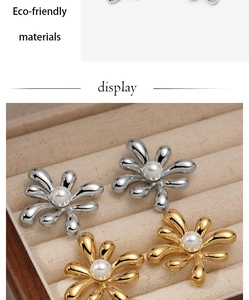 Macro detail of irregular flower pearl earrings in gold and silver plating