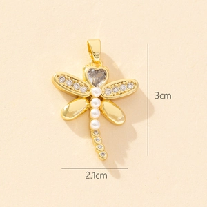 Detailed view of dragonfly pendant with heart zircon and dimensions 3cm by 2.1cm