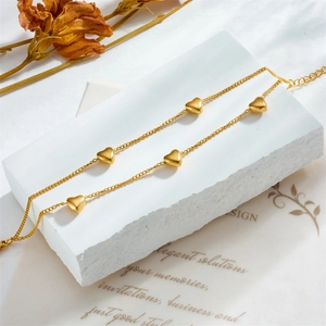 Elegant gold double-layered titanium steel chain bracelet with five polished heart charms