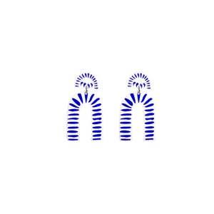 Macro shot of U-shaped blue and white porcelain pattern earrings with geometric stripe detail