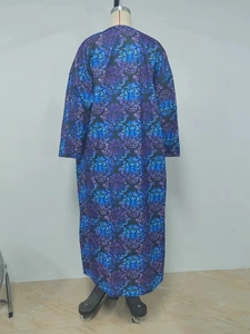 Detailed back view of long sleeve coat with blue and purple damask floral patterns