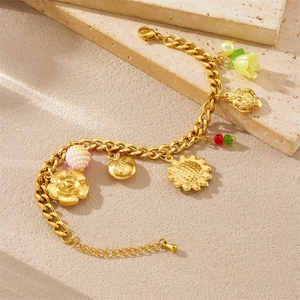 Bracelet chaîne cubaine en acier doré avec pendentifs tournesol et rose sur pierre