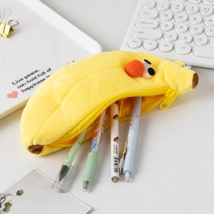 Detail showing plush banana pencil case interior with various colorful pens inside