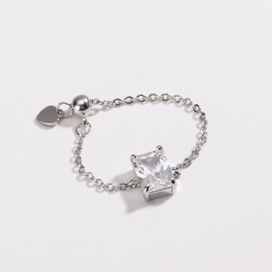 Detailed macro view of adjustable silver chain ring featuring a large rectangular zircon stone