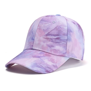 Detail of colorful tie-dye baseball cap with pink and purple gradient twill fabric