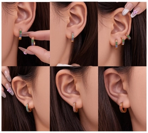 Detailed view of C-shaped huggie earrings with colorful micro-pave zircon crystals