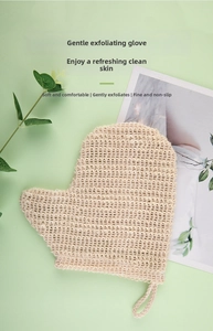 Close-up of natural linen exfoliating bath glove with thumb design on green background