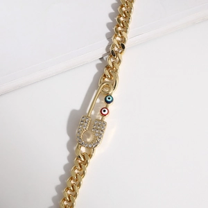 Gold evil eye paperclip bracelet with pavé cubic zirconia on a minimalist cuban chain