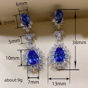 Luxury blue teardrop crystal earrings with silver-tone diamonds, measuring 38mm in length