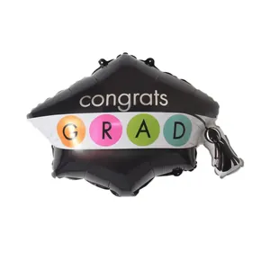 Detail of graduation cap balloon with congrats GRAD text and colorful tassel accents
