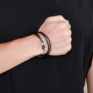 Outdoor black multi-layer leather wrap bracelet with silver fishhook clasp on male wrist