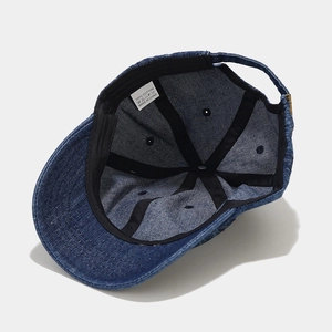 Retro washed denim baseball cap with short brim and adjustable metal strap back buckle
