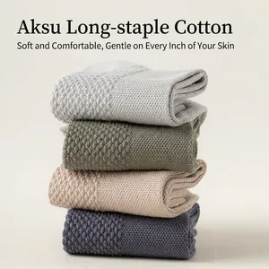 Set of four cotton crew socks in neutral colors with premium waffle knit texture