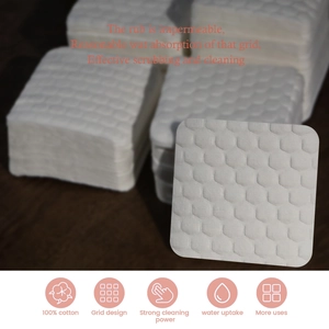 Detail showing 100% cotton nail wipes with a textured honeycomb grid for deep cleaning