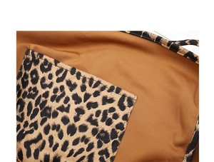 Detailed close-up of the leopard print pocket and stitching on a canvas tote bag