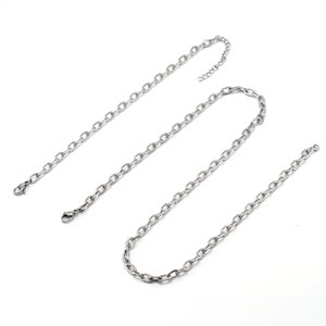 Three textured silver stainless steel cross chains with lobster clasps on white background