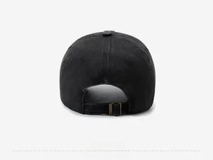 Detail of vintage washed black cotton baseball cap showing adjustable metal back buckle
