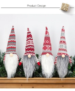Detailed view of four knitted Christmas gnomes with snowflake patterns on a mantle