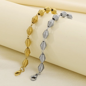 Bracciali in acciaio al titanio placcati oro 18K e argento con perline a spirale e moschettone