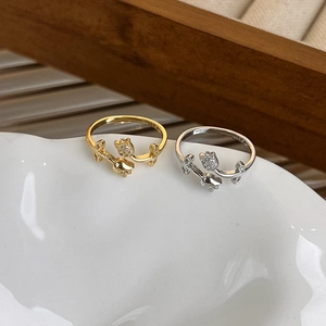 Minimalist tulip ring with micro-pave crystals in gold and silver finish