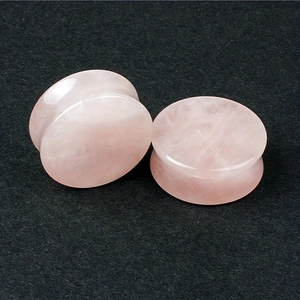 Pair of rose quartz tunnel ear expanders with a double flared design for body piercing
