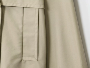 Close-up of khaki water-resistant fabric texture and precise stitching on pocket
