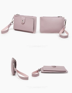 Detail view of light purple lychee pattern leather coin purse with zipper and metal button