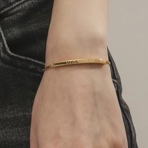 Minimalist gold titanium steel chain bracelet featuring LOVER DREAM engraving for unisex