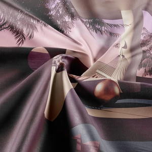 Close-up of bohemian tapestry fabric with palm trees and a smooth satin texture