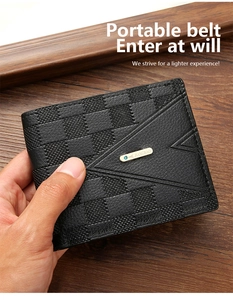 Close-up of black checkerboard embossed leather wallet held in hand over wooden desk