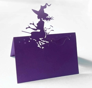 Halloween purple place card with laser-cut witch design for festive table settings