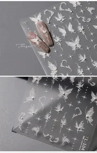 Detailed 3D embossed white nail stickers featuring stars, butterflies and faux pearls