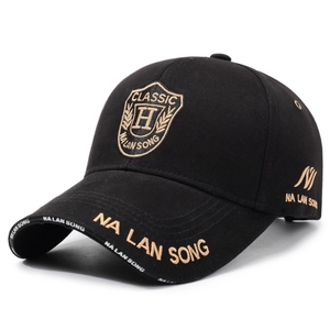 Black baseball cap with classic shield embroidery and gold lettering on structured crown