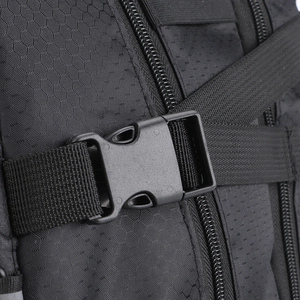 Detail of water-resistant honeycomb fabric with durable buckle and strap on black backpack