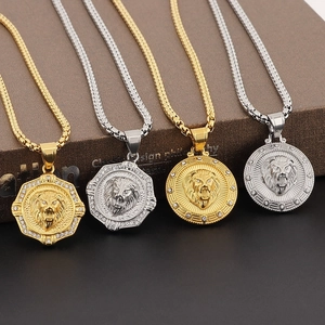 Detailed macro view of four hip hop lion head pendants with zircons on display boxes