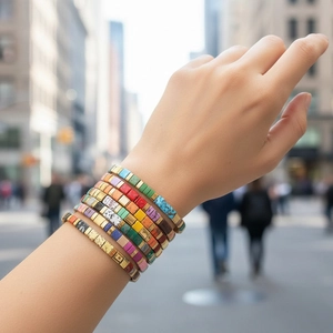 Bohemian Tila bead bracelet set featuring colorful stacked tiles on model wrist