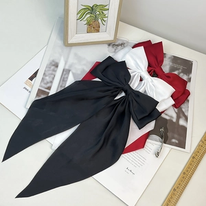 Elegant oversized satin bow hair clip set in black, white, and wine red with long ribbons