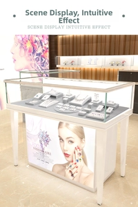 Detailed top view of a white lacquered jewelry display case with tempered glass