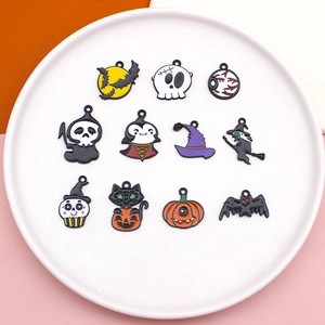 Close-up of colorful Halloween alloy pendants including pumpkin and ghost designs