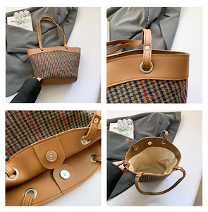 Detail view of striped tote bag showing stitching, magnetic clasp and interior space