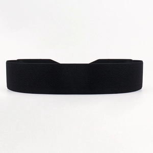 Detail of black elastic waist belt with textured stretch fabric and reinforced stitching