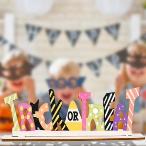 Colorful wooden Trick or Treat tabletop sign for Halloween party decor with candy corn