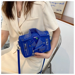 Detail of blue biker jacket crossbody bag with metallic studs and zipper design