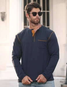 Detail view of navy Henley shirt featuring orange contrast stitching and chest pocket