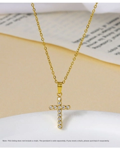 Detailed macro shot of gold cross pendant with micro-pave cubic zirconia crystals