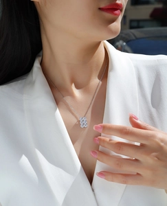 Silver S925 necklace with a square moissanite cluster pendant shown on a model