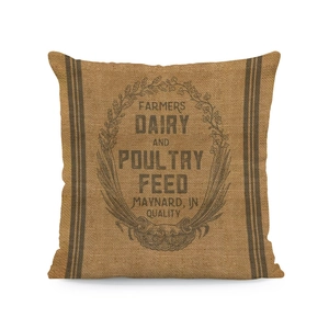 Detail of vintage farmers dairy print on a square beige linen textured pillowcase